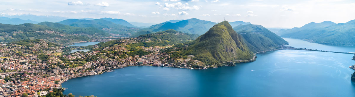Panorama über den Lago di Lugano im Tessin, ideale Kulisse für eine Italienisch Sprachreise in der Schweiz.